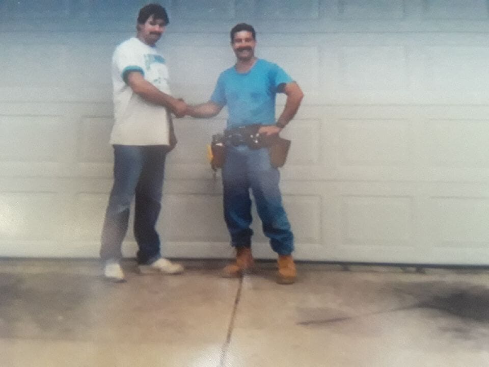 Owner Peter Loukas with a customer in 1991